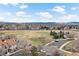 Aerial view of a residential area with mountain views in the distance at 7770 W 87Th Dr # F, Arvada, CO 80005