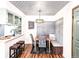 Bright dining area features custom ceiling and integrated bench seating, creating a cozy spot for meals at 7770 W 87Th Dr # F, Arvada, CO 80005