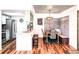Eat-in kitchen and dining area with decorative ceiling, bench seating, and modern light fixture at 7770 W 87Th Dr # F, Arvada, CO 80005