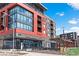 The building's exterior features a Tap & Burger restaurant on the ground floor with modern architectural details at 7770 W 87Th Dr # F, Arvada, CO 80005
