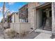 Townhome featuring a stone facade, multiple levels, and staircase access at 7770 W 87Th Dr # F, Arvada, CO 80005