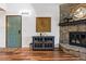 Inviting living room with hardwood floors, stone fireplace, and stylish decor at 7770 W 87Th Dr # F, Arvada, CO 80005