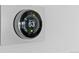 Smart thermostat set to 63 degrees for energy-efficient climate control at 7770 W 87Th Dr # F, Arvada, CO 80005