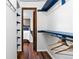 Functional walk-in closet offers built-in shelving and hanging rods for an organized storage solution at 7770 W 87Th Dr # F, Arvada, CO 80005