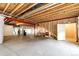 Unfinished basement with exposed ceiling, open layout, and metal support beams at 3855 Old Oaks St, Castle Rock, CO 80104