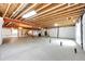 Large unfinished basement with concrete floor, exposed ceiling, and visible utilities, ready for customization and expansion at 3855 Old Oaks St, Castle Rock, CO 80104