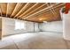 Partially finished basement space, featuring concrete floors, exposed ceilings, and a functional layout at 3855 Old Oaks St, Castle Rock, CO 80104