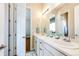 Charming bathroom boasts double sinks, white cabinetry, and ample counter space at 3855 Old Oaks St, Castle Rock, CO 80104