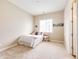 Cozy bedroom featuring neutral walls, a plush carpet, and a sunny window for natural light at 3855 Old Oaks St, Castle Rock, CO 80104