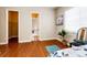 Bright bedroom with hardwood floors, closet and doorway to a room, and light neutral paint at 3855 Old Oaks St, Castle Rock, CO 80104