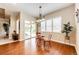 Cozy dining area with hardwood floors and natural light from windows and glass sliding doors at 3855 Old Oaks St, Castle Rock, CO 80104