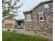 Attractive two-story home showcasing a combination of stone and siding, paired with manicured landscaping at 3855 Old Oaks St, Castle Rock, CO 80104