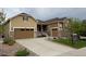 Charming two-story home featuring a well-maintained lawn, stone details, and a convenient two-car garage at 3855 Old Oaks St, Castle Rock, CO 80104
