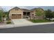 Inviting exterior of a two-story home with a well-manicured lawn, stone accents, and a spacious two-car garage at 3855 Old Oaks St, Castle Rock, CO 80104