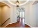 Inviting foyer featuring hardwood floors, modern lighting, and a seamless transition into the home's elegant design at 3855 Old Oaks St, Castle Rock, CO 80104