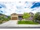 Charming home with a well-manicured lawn, attractive siding, and a welcoming front porch at 3855 Old Oaks St, Castle Rock, CO 80104