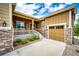 Lovely home featuring stone accents, a cozy front porch, and an attached garage at 3855 Old Oaks St, Castle Rock, CO 80104