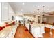 Modern kitchen with stainless appliances, large island, granite countertops, and custom cabinetry at 3855 Old Oaks St, Castle Rock, CO 80104