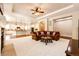 Spacious living room flowing into a modern kitchen, perfect for entertaining and Gathering gatherings at 3855 Old Oaks St, Castle Rock, CO 80104