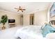 Spacious main bedroom with ensuite bathroom featuring a ceiling fan and neutral decor at 3855 Old Oaks St, Castle Rock, CO 80104