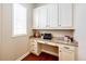 Office nook with custom cabinetry, granite countertop, and natural light at 3855 Old Oaks St, Castle Rock, CO 80104