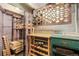 Wine storage space with custom racks and shelving, illuminated for display at 408 E 1St Ave, Denver, CO 80203