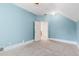 Cozy bedroom showcases light blue walls, neutral carpet, and white trim at 408 E 1St Ave, Denver, CO 80203