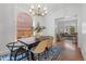 Elegant dining room with a modern chandelier and stylish furnishings at 408 E 1St Ave, Denver, CO 80203