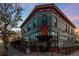 Stylish corner building exterior featuring unique signage and inviting storefront, located in a lively urban setting at 408 E 1St Ave, Denver, CO 80203