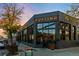 Charming dark painted corner building exterior with large windows and tasteful signage, enhancing curb appeal at 408 E 1St Ave, Denver, CO 80203