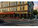 Street-level view of restaurant with an orange awning and patio seating, creating an inviting outdoor dining experience at 408 E 1St Ave, Denver, CO 80203