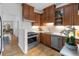 Modern kitchen with stainless steel appliances, custom wood cabinets and white subway tiles at 408 E 1St Ave, Denver, CO 80203