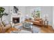 Cozy living room featuring a fireplace and hardwood floors at 408 E 1St Ave, Denver, CO 80203