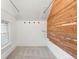 Charming walk-in closet with cedar siding and a built-in hanging system at 408 E 1St Ave, Denver, CO 80203