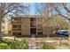 Inviting exterior view of the building, showcasing a well-maintained facade and landscaping at 4070 S Atchison Way # 203, Aurora, CO 80014