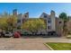 A three-story condominium building with unique architectural design and well-maintained landscaping at 4070 S Atchison Way # 203, Aurora, CO 80014