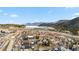 Stunning aerial view of the town, showcasing a neighborhood with a lake, mountains and open spaces at 57 Audrey Cir, Breckenridge, CO 80424