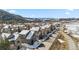 An aerial view of a neighborhood nestled among trees, showcasing mountain views at 57 Audrey Cir, Breckenridge, CO 80424