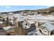 Captivating aerial view of homes in a winter wonderland, showcasing snow-covered landscapes and mountain views at 57 Audrey Cir, Breckenridge, CO 80424