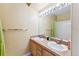 Bright bathroom featuring a double sink vanity, a large mirror and a shower/tub combo at 57 Audrey Cir, Breckenridge, CO 80424