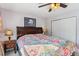 Bedroom featuring a ceiling fan, side table, and closet at 57 Audrey Cir, Breckenridge, CO 80424