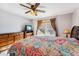 Bedroom features a ceiling fan, dresser, and a large window at 57 Audrey Cir, Breckenridge, CO 80424