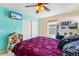 Bedroom with ceiling fan, TV, closet, and a serene blue accent wall at 57 Audrey Cir, Breckenridge, CO 80424