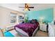 Bright bedroom features a ceiling fan, desk, and calming blue accent wall at 57 Audrey Cir, Breckenridge, CO 80424