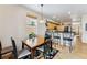 Bright dining area with a wooden table, black chairs and colorful area rug near the kitchen at 57 Audrey Cir, Breckenridge, CO 80424