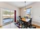 Dining area with a wood table, black chairs, and a sliding glass door with an outdoor view at 57 Audrey Cir, Breckenridge, CO 80424