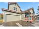 Home exterior features a garage, porch and is painted gray at 57 Audrey Cir, Breckenridge, CO 80424