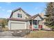 Charming two-story home with attached garage and covered front porch at 57 Audrey Cir, Breckenridge, CO 80424