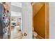 Open hallway leading to living area with a half-bathroom in the foreground at 57 Audrey Cir, Breckenridge, CO 80424