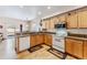 A traditional-style kitchen with wood cabinets, a breakfast bar, and stainless steel appliances at 57 Audrey Cir, Breckenridge, CO 80424
